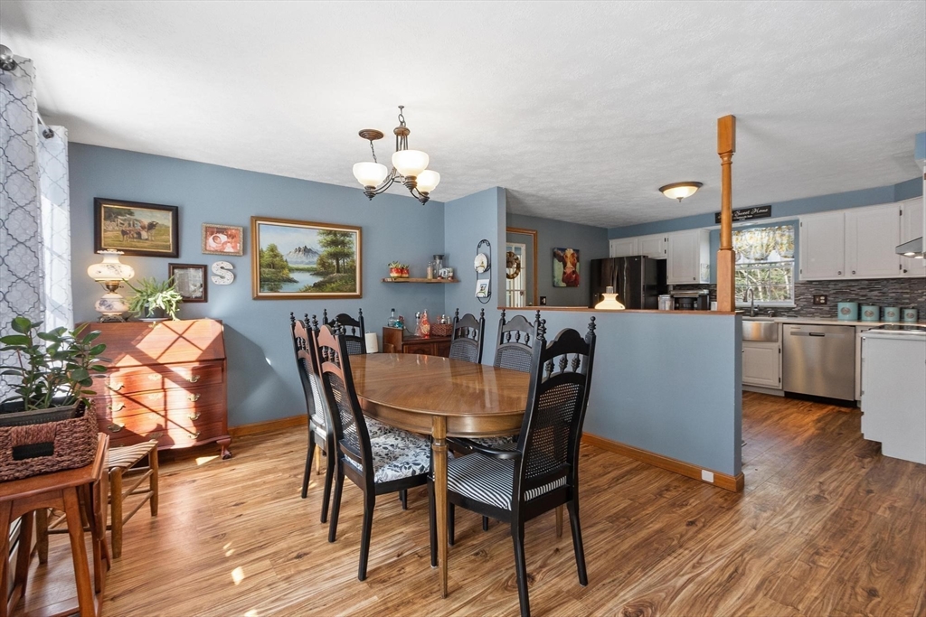 112 Baldwinville State Road Winchendon, MA 01475 - Photo 8 of 42 a view of a dining room with furniture and wooden floor