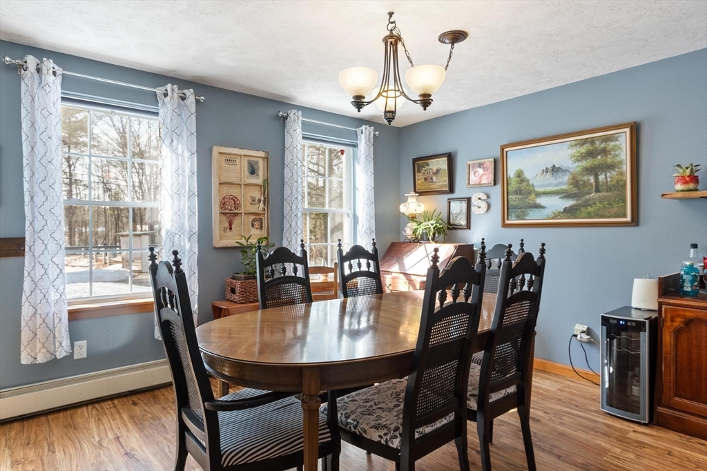 112 Baldwinville State Road Winchendon, MA 01475 - Photo 9 of 42 a view of a dining room with furniture window and wooden floor