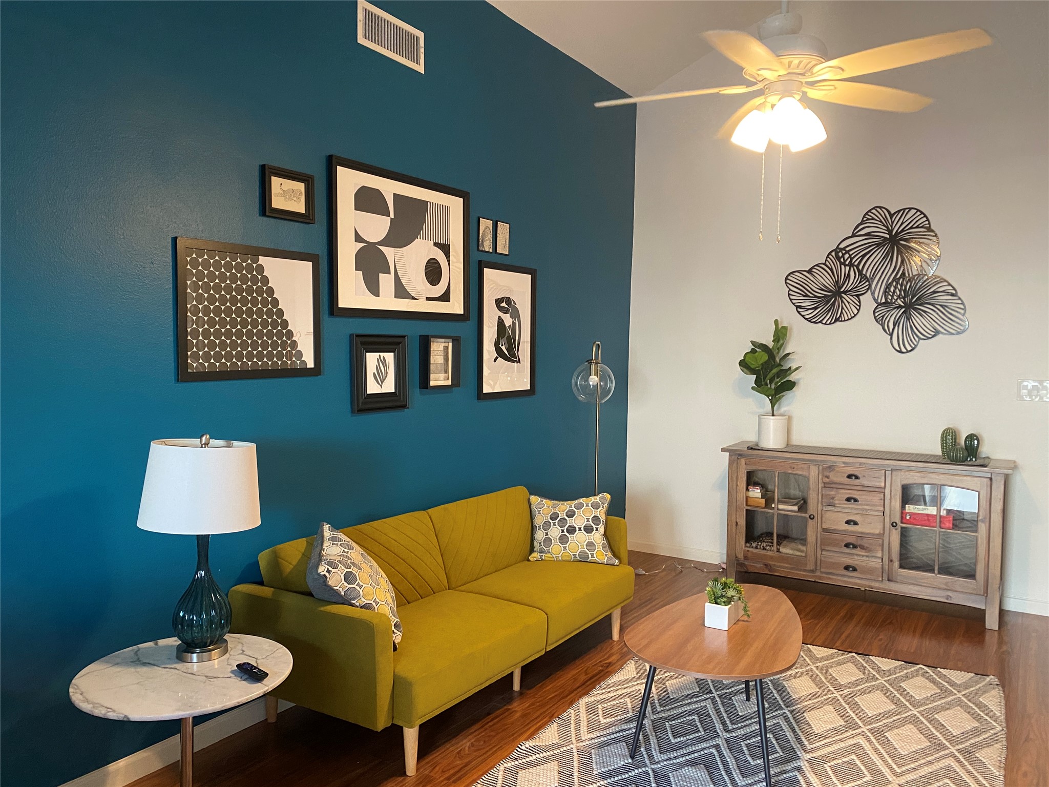 5405 Brompton Circle, Unit B Austin, TX 78745 - Photo 2 of 19 Living area with wood finished floors, a ceiling fan, and high vaulted ceiling