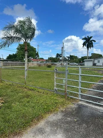 a view of a golf course with a lake view