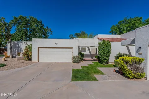 front view of a house with a yard