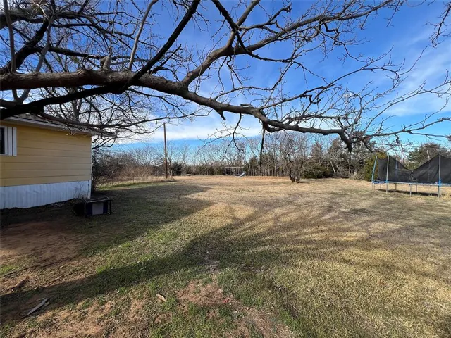 a view of a backyard of a house