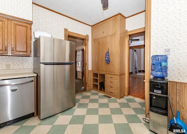 a kitchen with stainless steel appliances a refrigerator and cabinets