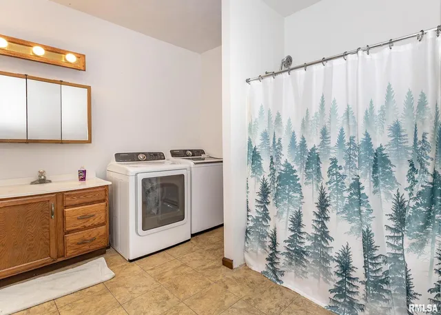 a utility room with dryer and washer