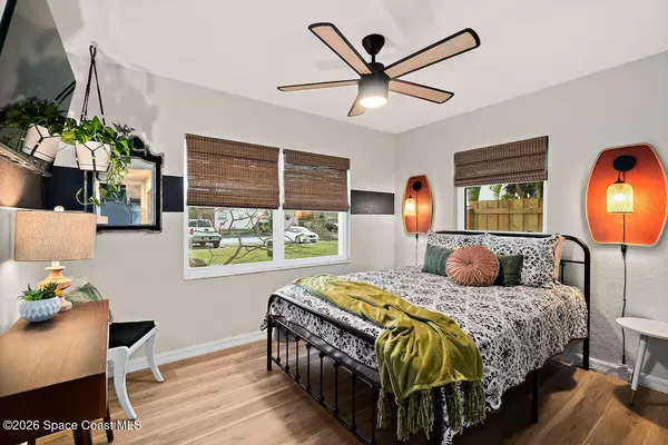 a view of a livingroom with furniture and a flat screen tv