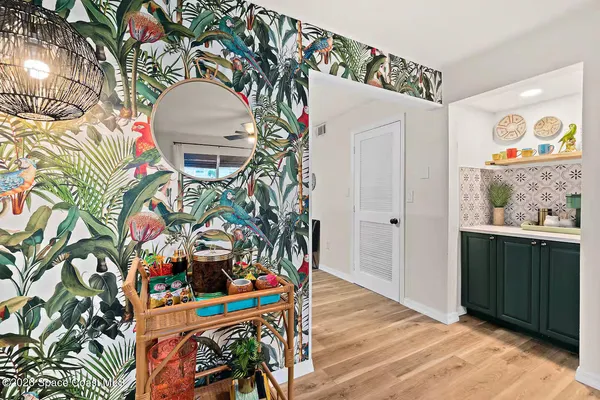 a view of a chairs and table in the balcony