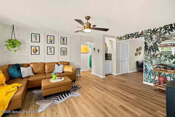 a kitchen with stainless steel appliances granite countertop a stove a kitchen island a dining table and chairs with wooden floor