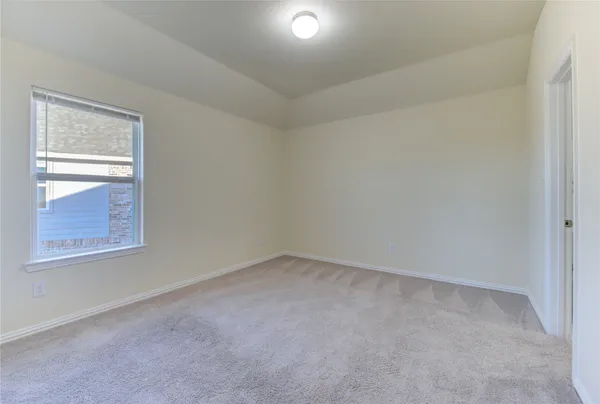 an empty room with closet area