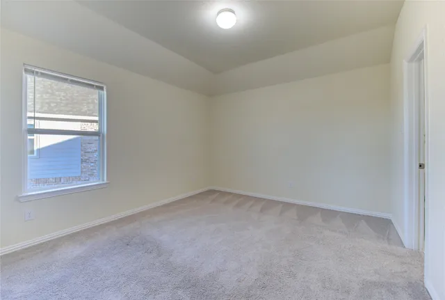 an empty room with closet area