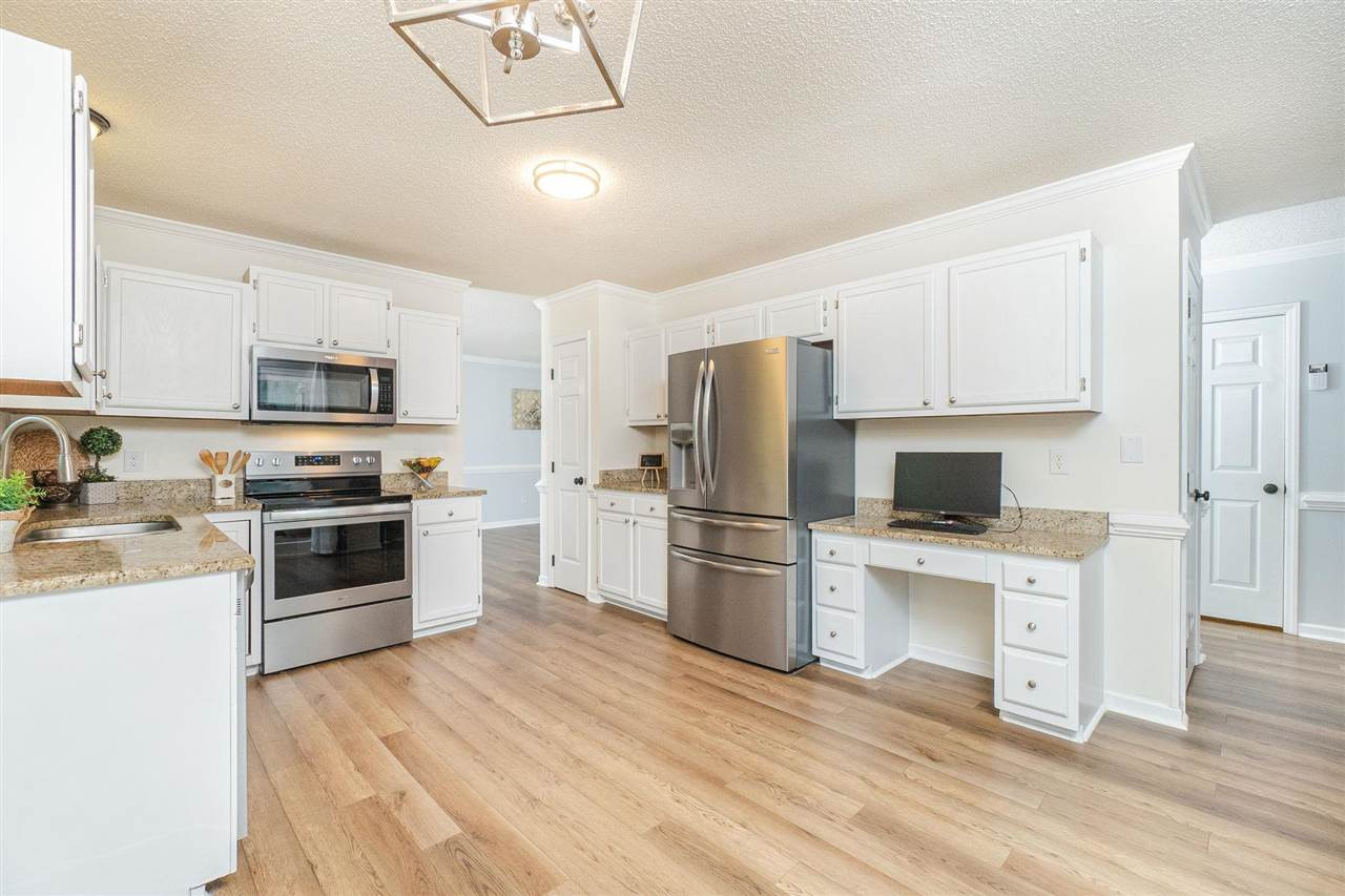 3 Bay Ridge Court Durham, NC 27707 - Photo 11 of 25 SS appliances, granite, and clean white cabinetry