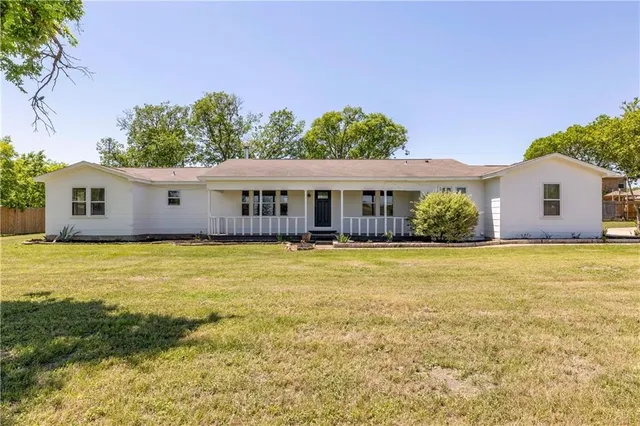 a view of a house with a swimming pool