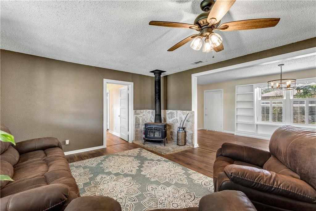211 Tate Lane Round Rock, TX 78665 - Photo 16 of 40 a living room with furniture and a fireplace