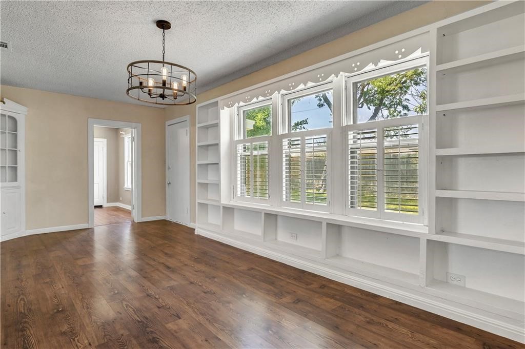 211 Tate Lane Round Rock, TX 78665 - Photo 23 of 40 a view of an empty room with a window and wooden floor