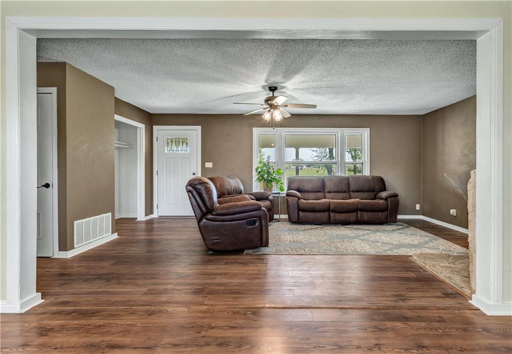 211 Tate Lane Round Rock, TX 78665 - Photo 26 of 40 a living room with furniture and a chandelier