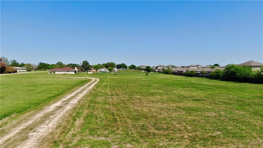 211 Tate Lane Round Rock, TX 78665 - Photo 27 of 40 a view of a golf course with a garden