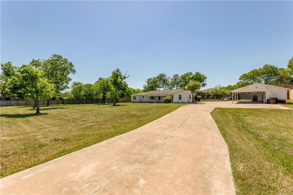 211 Tate Lane Round Rock, TX 78665 - Photo 29 of 40 a swimming pool with wooden fence