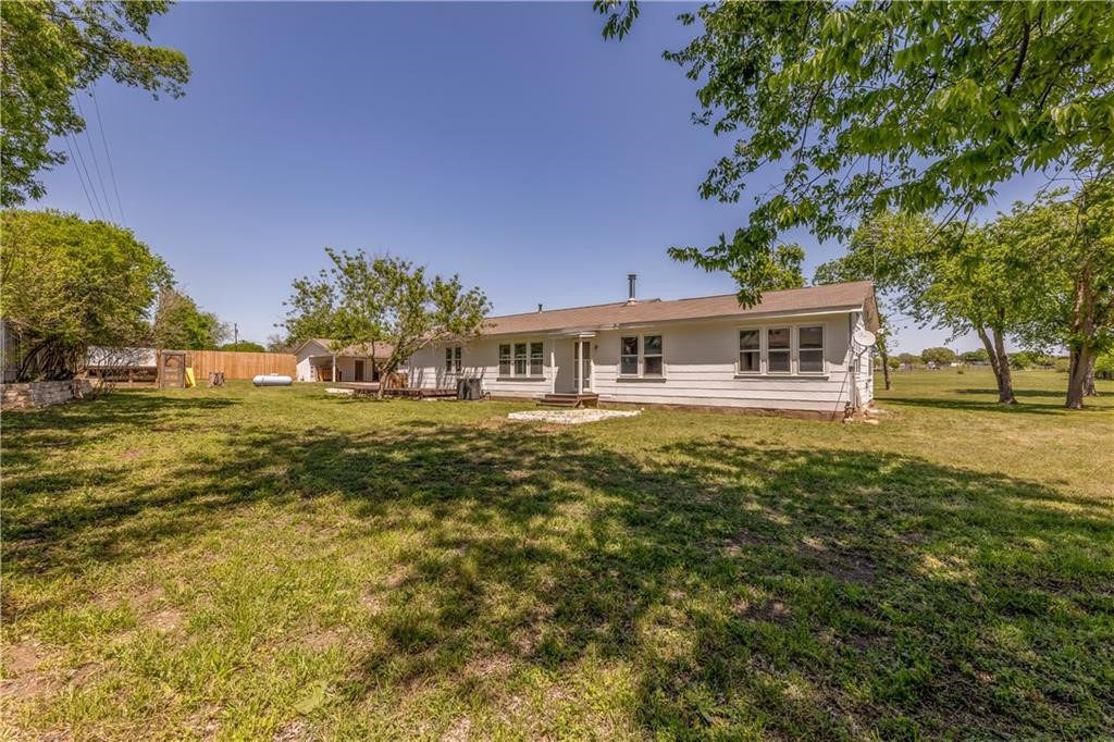 211 Tate Lane Round Rock, TX 78665 - Photo 30 of 40 a front view of a house with garden
