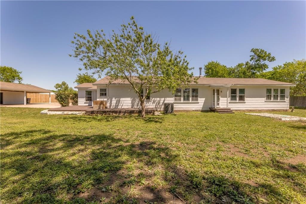211 Tate Lane Round Rock, TX 78665 - Photo 31 of 40 a front view of a house with garden