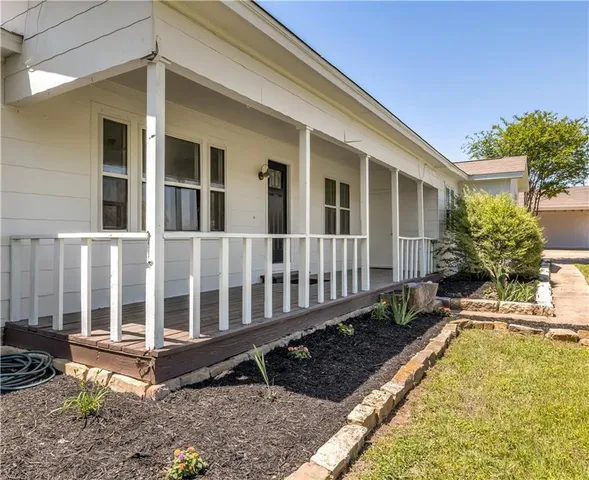 a view of house with a swimming pool