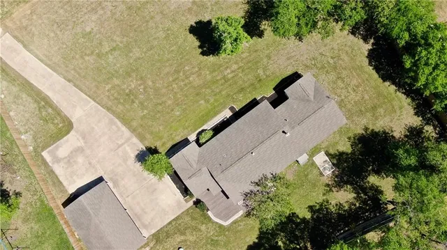 an aerial view of houses with yard