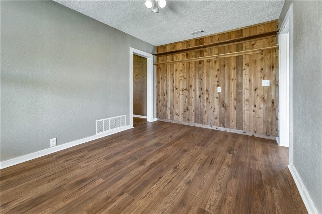 211 Tate Lane Round Rock, TX 78665 - Photo 10 of 40 a view of an empty room with wooden floor