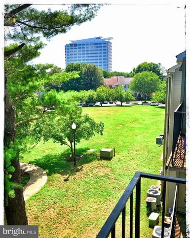 a view of a garden from a balcony