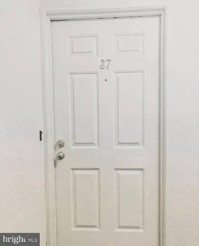 view of door with cabinet