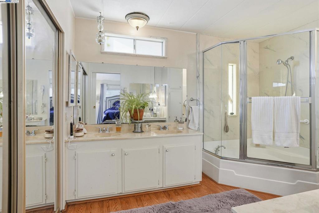 4141 Deep Creek Road Fremont, CA 94555 - Photo 31 of 54 a bathroom with a tub sink shower and mirror