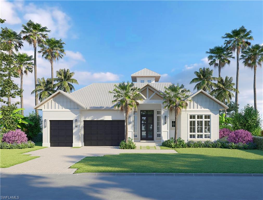 2130 Tarpon Road Naples, FL 34102 - Photo 1 of 12 a front view of a house with a garden and a yard