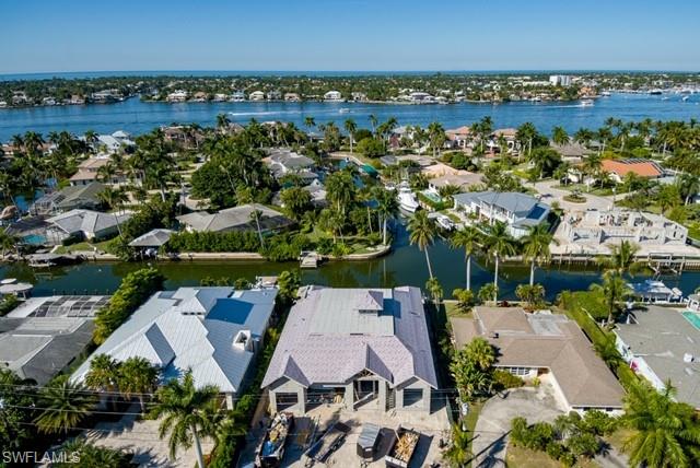 2130 Tarpon Road Naples, FL 34102 - Photo 5 of 12 an aerial view of a house with a lake view
