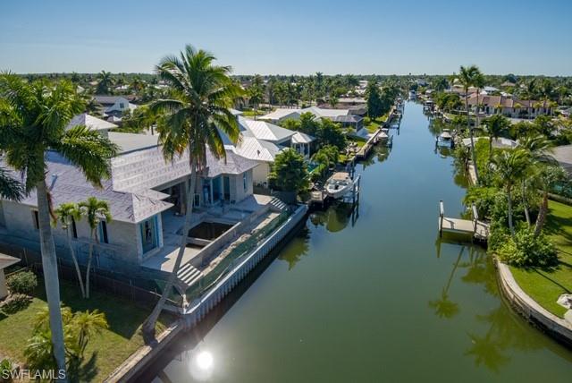 2130 Tarpon Road Naples, FL 34102 - Photo 7 of 12 an aerial view of a house with a lake view
