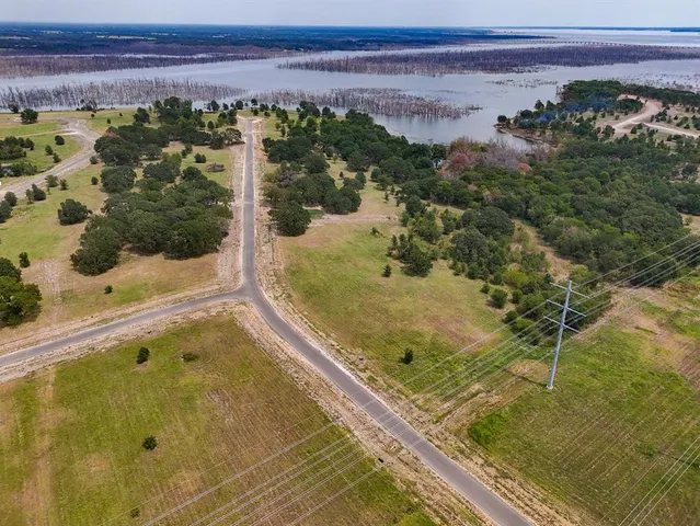 a view of a balcony with a yard