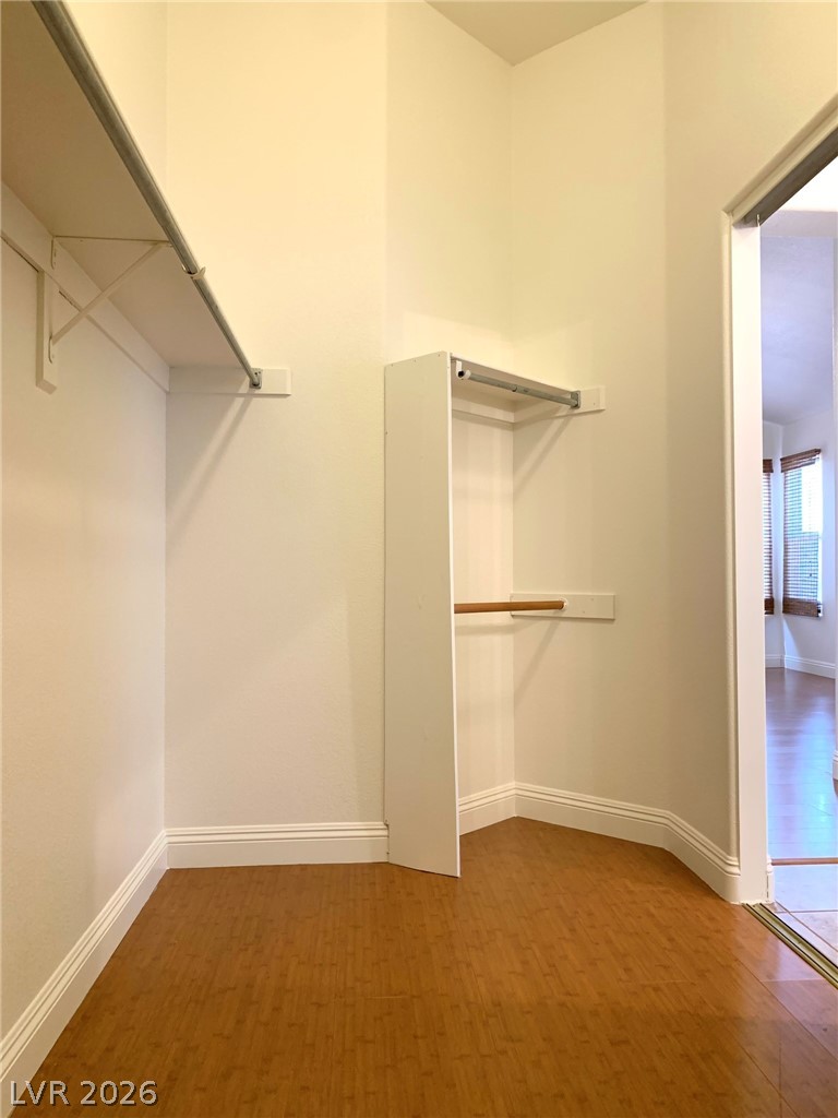 3821 Bombastic Court Las Vegas, NV 89147 - Photo 28 of 36 This spacious closet features ample storage and rich wood flooring.