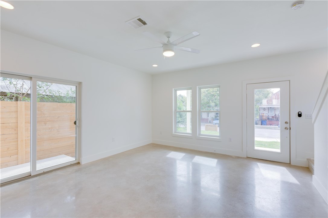 1906 East 17th Street, Unit 1 Austin, TX 78702 - Photo 13 of 33 an empty room with wooden floor and windows