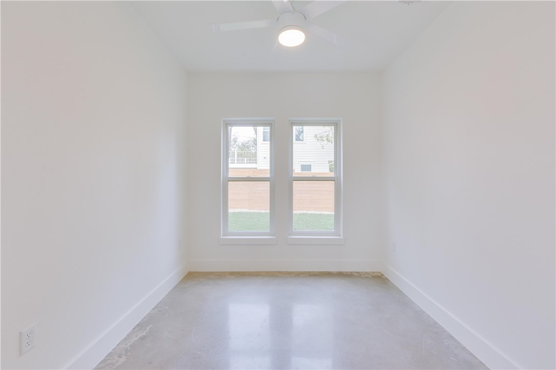 1906 East 17th Street, Unit 1 Austin, TX 78702 - Photo 19 of 33 an empty room with windows