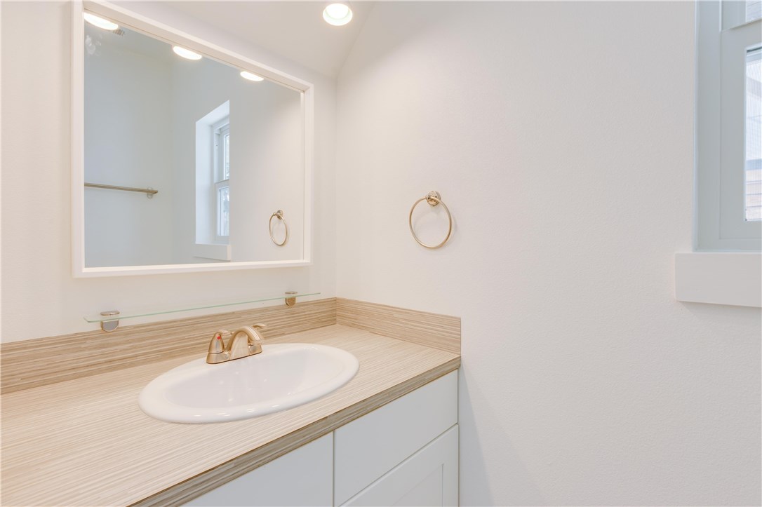 1906 East 17th Street, Unit 1 Austin, TX 78702 - Photo 21 of 33 a bathroom with a sink and a mirror