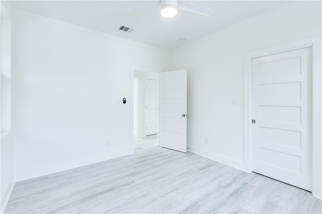 1906 East 17th Street, Unit 1 Austin, TX 78702 - Photo 33 of 33 a view of an empty room with wooden floor
