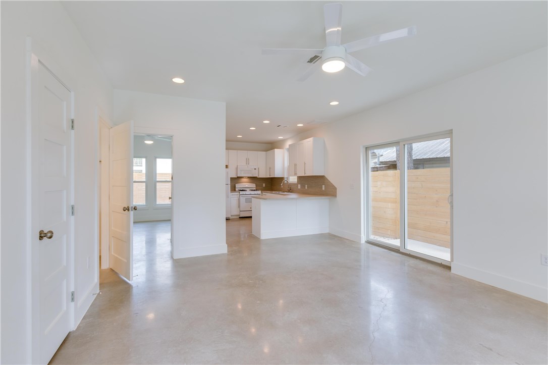 1906 East 17th Street, Unit 1 Austin, TX 78702 - Photo 10 of 33 a view of a kitchen with a sink and a refrigerator