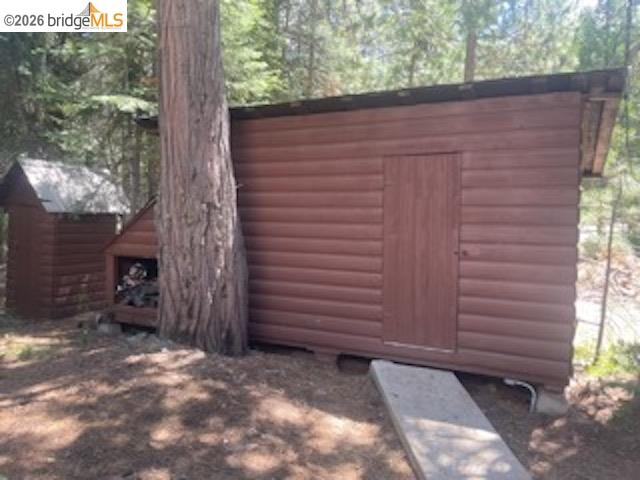 26591 Snow Bowl Road Long Barn, CA 95335 - Photo 25 of 38 a view of a backyard with a large tree