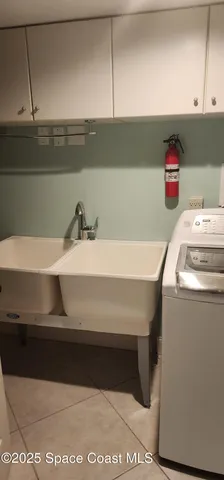 a view of kitchen with furniture and a fireplace