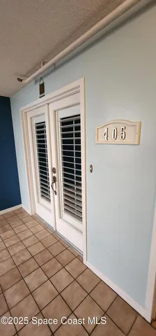 a view of a room with wooden floor and window
