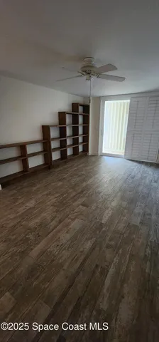 a bathroom with a granite countertop sink a mirror and bathtub