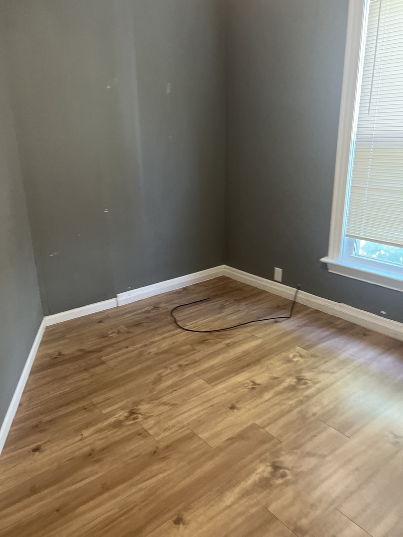 12124 South Normal Avenue Chicago, IL 60628 - Photo 25 of 36 a view of empty room with window
