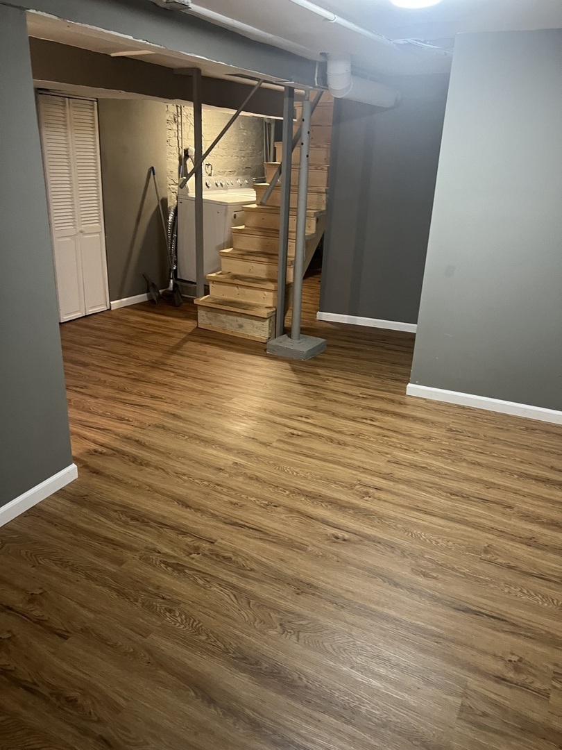 12124 South Normal Avenue Chicago, IL 60628 - Photo 27 of 36 a view of empty room with wooden floor