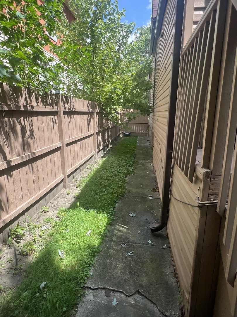 12124 South Normal Avenue Chicago, IL 60628 - Photo 35 of 36 a view of a backyard with a tree