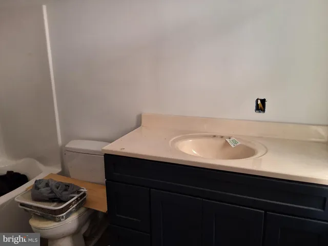 a bathroom with a sink toilet and vanity