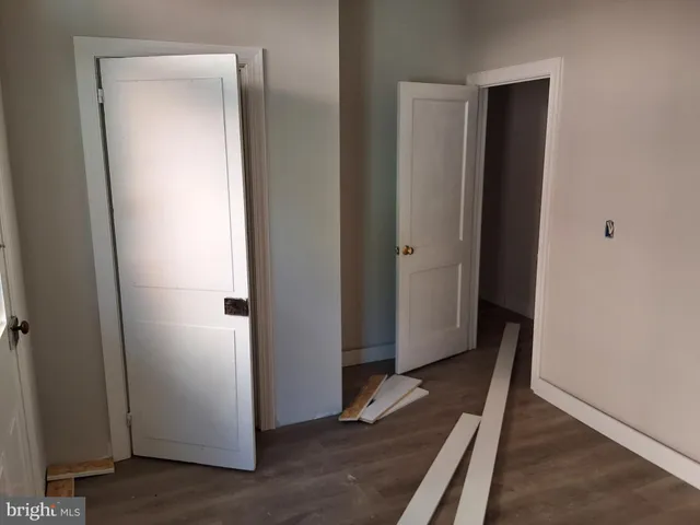 a view of front door with wooden floor