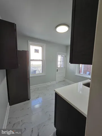 a kitchen with stainless steel appliances a refrigerator and stove