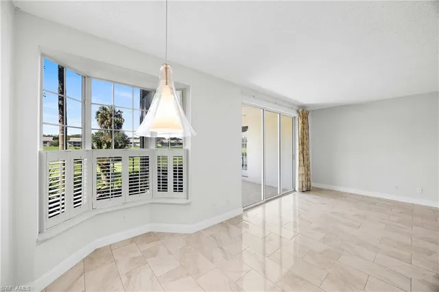 a view of a big room with closet and windows
