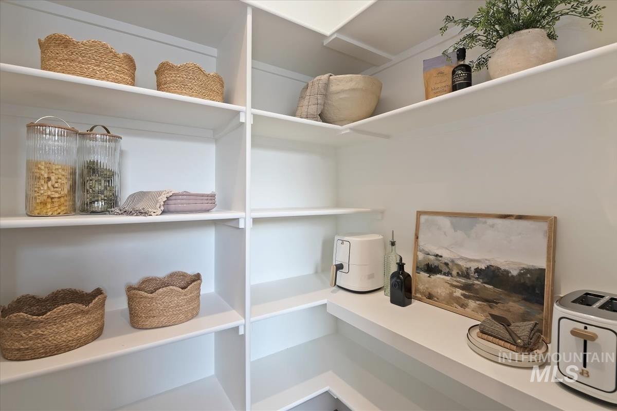 7615 Brown Way Eagle, ID 83714 - Photo 21 of 43 White shelving system with multiple tiers, offering extensive storage capacity